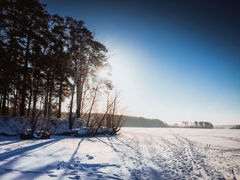 Scenic view of frozen landscape against clear sky