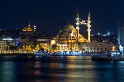 Illuminated buildings in city at night