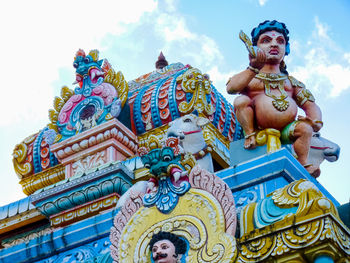 Low angle view of statue against building