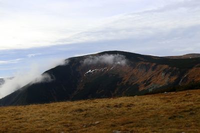 Scenic view of volcanic mountain against sky