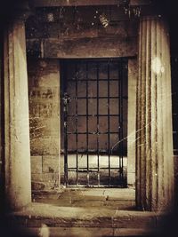 Abandoned building seen through window