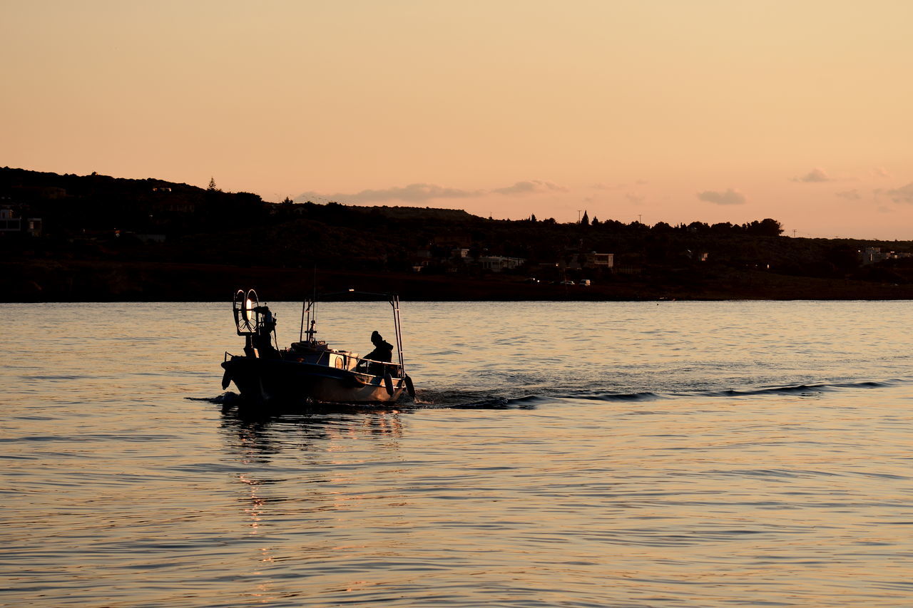 SILHOUETTE PEOPLE IN BOAT SAILING ON SEA AGAINST SKY