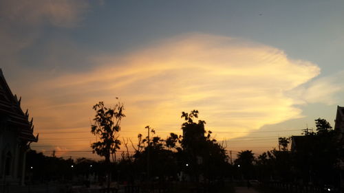 Silhouette trees against sky during sunset