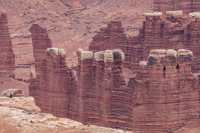 Rugged red sandstone rock formations tower above the eroded landscape