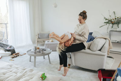 Mother and daughter playing together