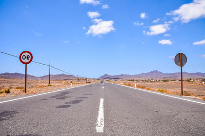Empty road against sky