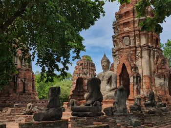 View of old temple against building