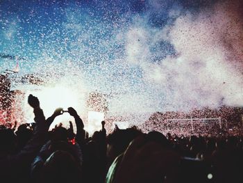 People enjoying music concert