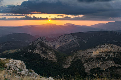 Scenic view of mountains against sky during sunset