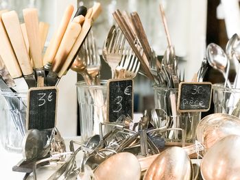 Kitchen utensils in containers in store