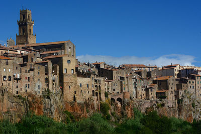 Low angle view of old ruins against clear blue sky
