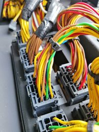 High angle view of multi colored pencils on metal