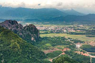 Scenic view of landscape and mountains against sky