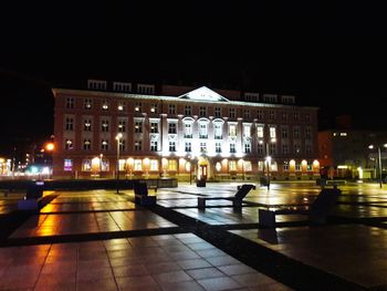 Illuminated buildings in city at night