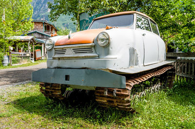 Antique snowmobile on grassy field