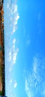 Low angle view of sea against blue sky