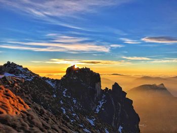 Scenic view of mountains against sky during sunset