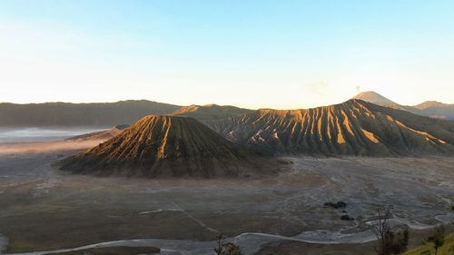 Panoramic view of volcanic landscape against sky