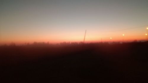 Silhouette landscape against sky during sunset