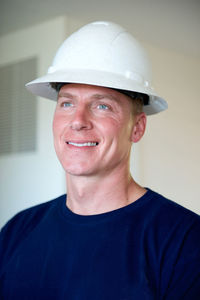 Portrait of young man in hard hat