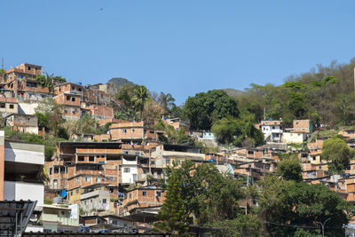 Rio, brazil - september 24, 2021 urban area with slums, simple buildings usually built hillsides