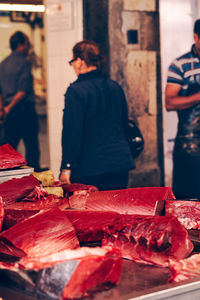 Group of people at market stall