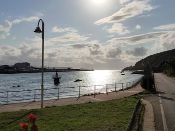 Street by sea against sky