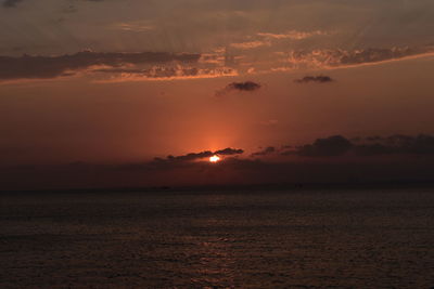 Scenic view of sea against romantic sky at sunset