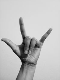 Close-up of human hand against white background