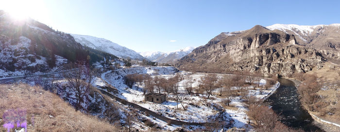 Scenic view of snowcapped mountains against sky