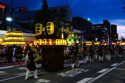 People on city street at night