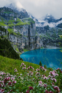 Scenic view of lake and mountains against sky