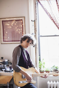 Young woman playing a guitar