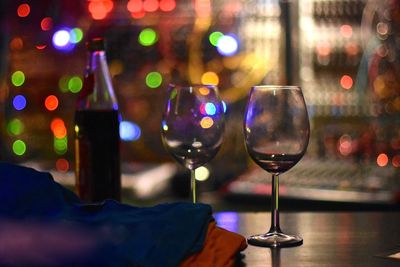 Wineglasses on table at night