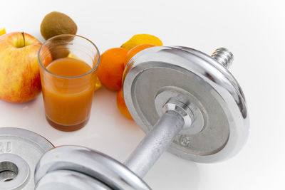 High angle view of orange on table against white background