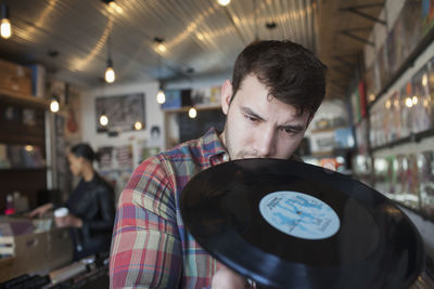 Young man in a record store.