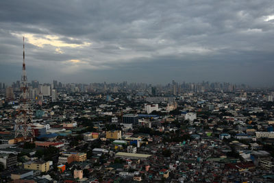 High angle view of city buildings against sky