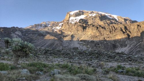 Scenic view of rocky mountains against clear sky