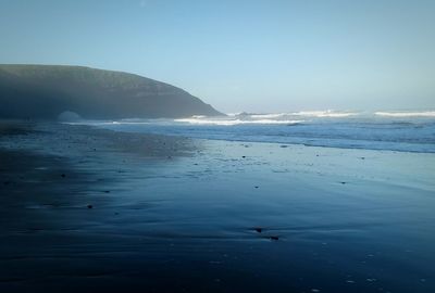 Scenic view of sea against blue sky