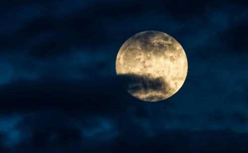 Low angle view of moon against sky at night