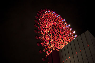 Low angle view of red lights at night