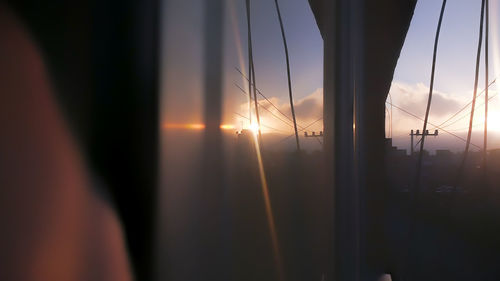 Close-up of silhouette window during sunset