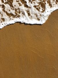 High angle view of sand on beach