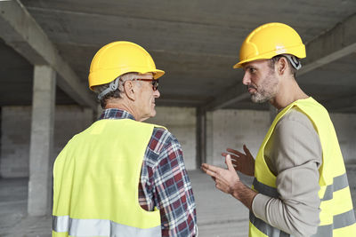 Rear view of man working on street