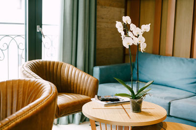 Flower vase on table at home