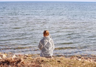 Rear view of woman looking at sea