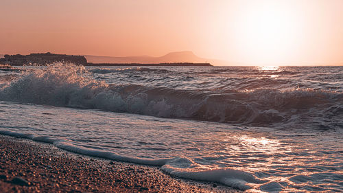 Scenic view of sea against clear sky during sunset