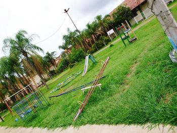 Panoramic shot of trees on field against sky