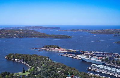 High angle view of bay against clear blue sky