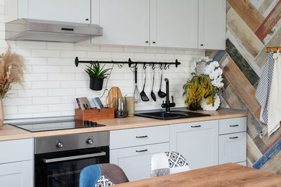 Interior of kitchen in rustic style with vintage kitchen ware and wooden wal